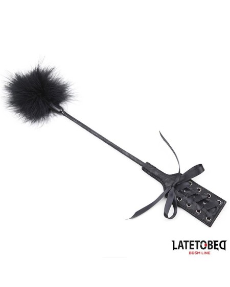 feather tickler and lace ribbon paddle